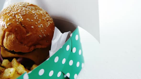 Hamburger and french fries on table