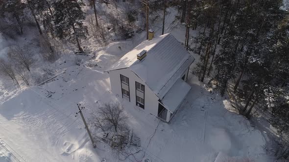 Aerial view of new white modern residential house at winter near the forest 17