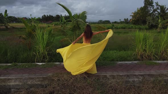 Woman Dancing in Tropics