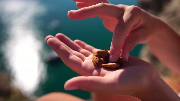 Woman Eating Milky Almond Nuts