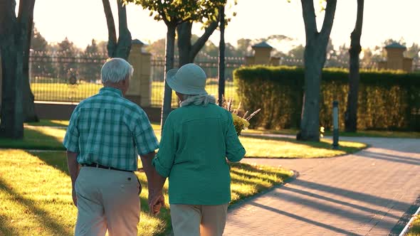 Couple Walking on Park Alley