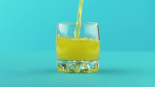 Fruit Fizzy Orange Soda Cold Beverage Drink Pooring Into Small Beautiful Glass Blue 