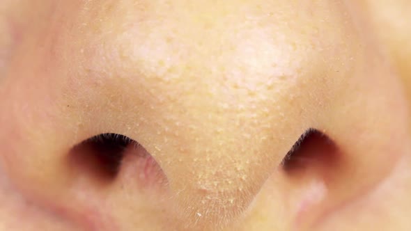 A Woman Breathes Through Her Nose - Closeup