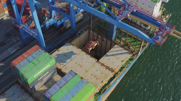 The Port Crane Raises the Cargo Hatch and Closes the Ships Hold