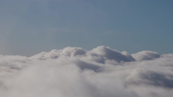 White Puff Clouds During a Sunny Day