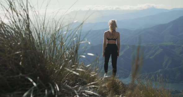 Young Blond Woman Looking At Dramatic Landscape Of La Concha