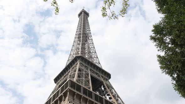 Eiffel tower in Paris France by partialy cloudy weather 4K 3840X2160 UHD footage - French Eiffel tow