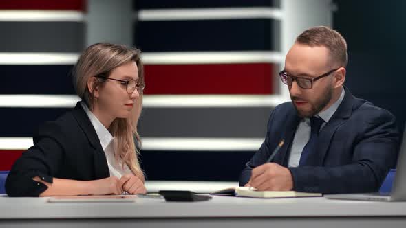 Male Boss Talking with Female Employee Brainstorming at Formal Meeting