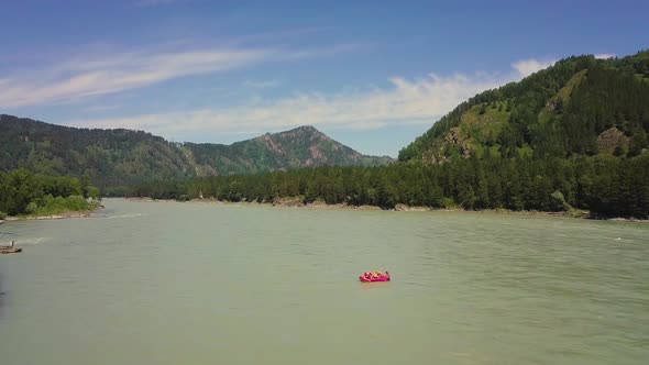 Aerial: Flying Over Mountain River. Also Visible: Coniferous Forest, Rapids on the River, Bank of