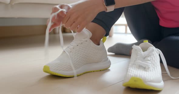 Woman wear sport shoes and prepare for running