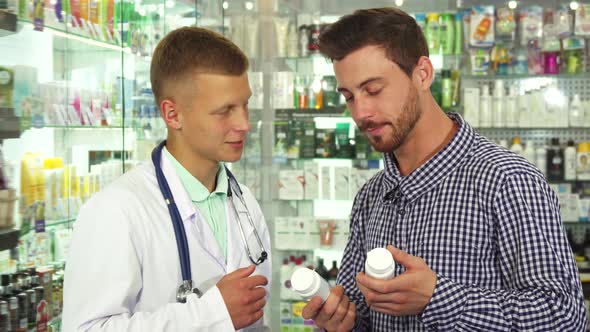 Doctor Consulting Patient About Two Drugs