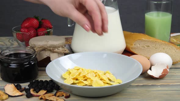 Breakfast. Pour corn flakes into a bowl