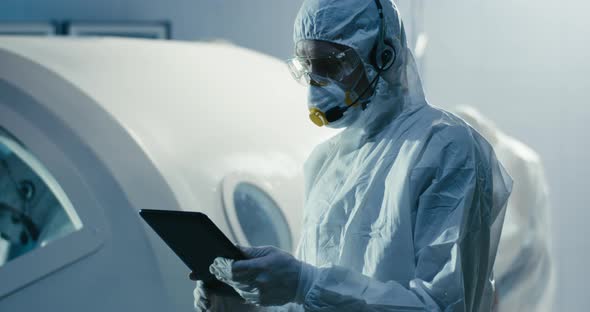 Engineer Using Tablet in Clean Room