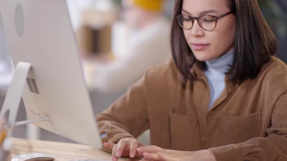 Female Designer Working on Computer in Office