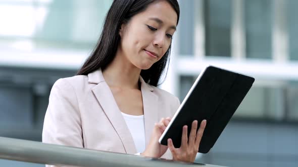 Business woman working on tablet computer 