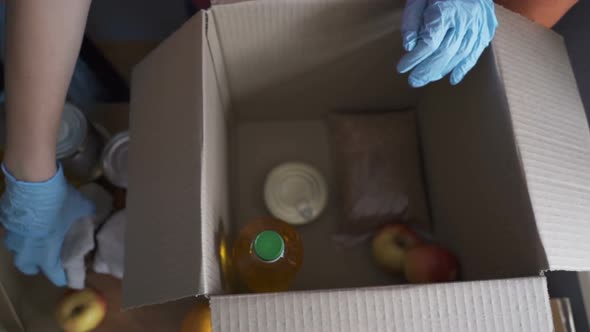 Volunteer in Protective Suits Pack Products.