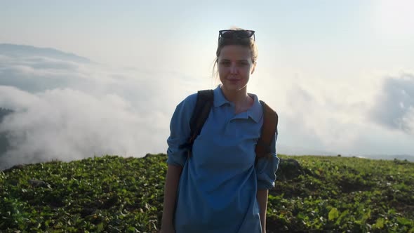 Woman Tourist on Top of Mountain After Hike at Summer