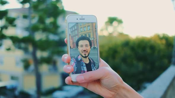 Closeup of Man Speaking on Video Call on Smartphone