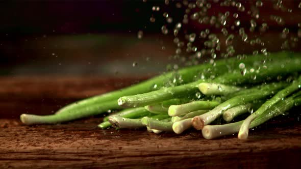 Super Slow Motion on the Green Onions Drop Water Droplets