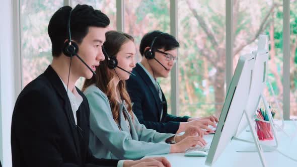 Business People Wearing Headset Working in Office