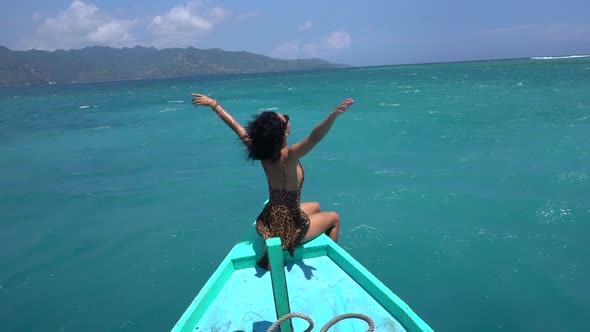 Cheerful Woman Sitting on the Boat Edge Enjoying Fresh Ocean and Wind Exciting Sailing to Idyllic