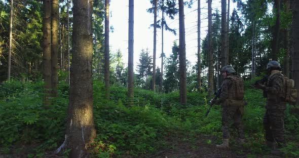 Soldiers Taking Aim From Rifle in Forest Smoke in Background Military and Army Concept