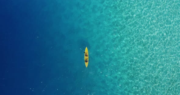 Kayaking together in a perfect blue lagoon