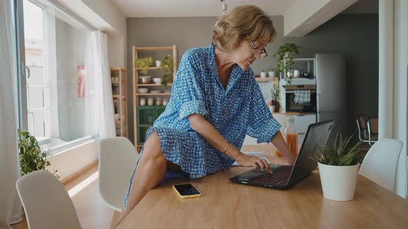 woman using laptop computer at home.