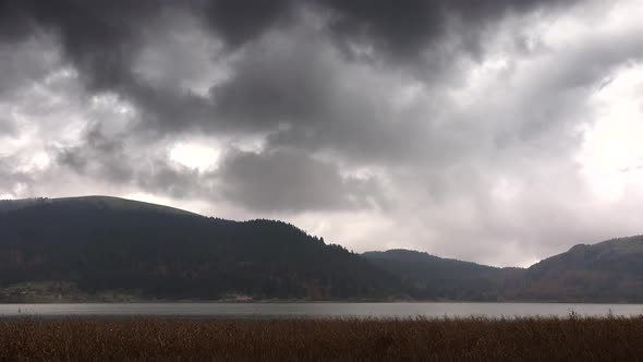 A Lake Under Gloomy Sky in Winter alt