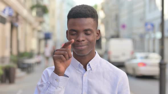 Portrait of African Man Pointing at the Camera and Inviting