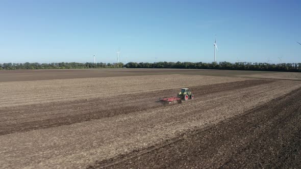 Moving tractor with plow