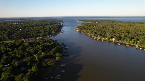 Aerial footage of Cedar Creek Lake in Texas east side with boat docks.