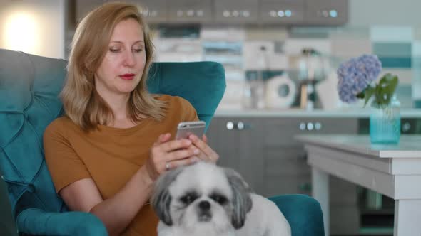 Woman Check Social Media with Shih Tzu Dog on Lap Rbbro