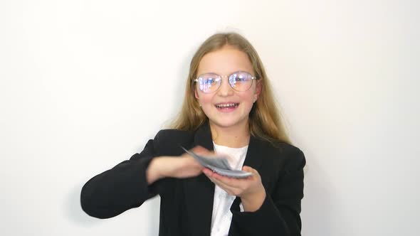 Child Girl in White Shirt Holding Money Isolated on White