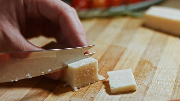 Gnocci with Tomato Sauce Being Sprinkled with Parmesan