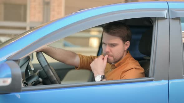 Pensive Young Man Thinking New Plan while Sitting in Car