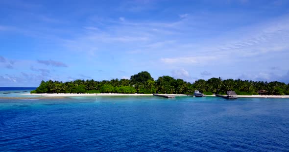 Daytime aerial abstract shot of a white sandy paradise beach and aqua turquoise water background in 