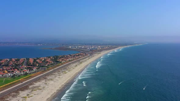 Side panning shot of highway 75 which is called Silver Strand blvd on Coronado beach in San Diego Ca