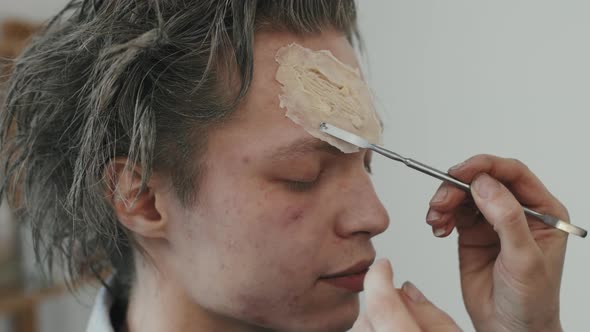 Putting SFX Makeup on Man