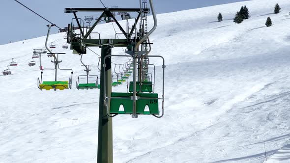 Ski Lift Chairs Move on the Rope Way at Alpine Winter Resort