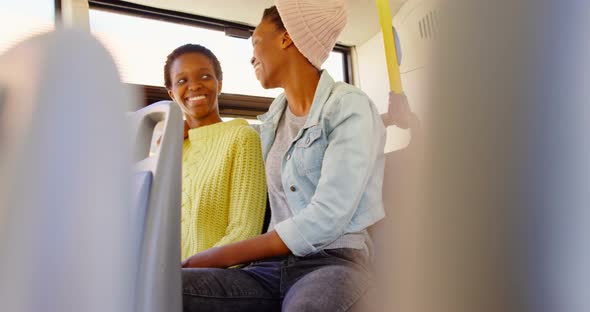 Twin sisters interacting with each other in the bus 4k