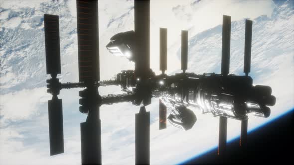 International Space Station in Outer Space Over the Planet Earth alt