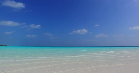 Wide angle drone abstract view of a paradise sunny white sand beach and blue sea background in hi re