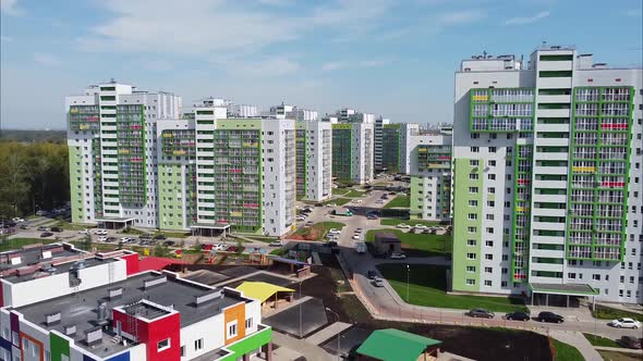 View of Modern Apartment Buildings and a Kindergarten with Bright Colorful Facades From a Bird's Eye