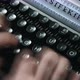 A man typing on a typewriter - VideoHive Item for Sale