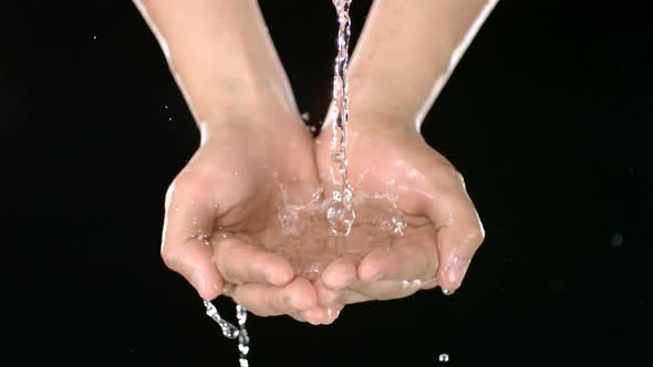 Water pours into hands, Slow Motion