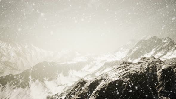 Heavy Snowing Focused on the Snowflakes Mountains in the Background