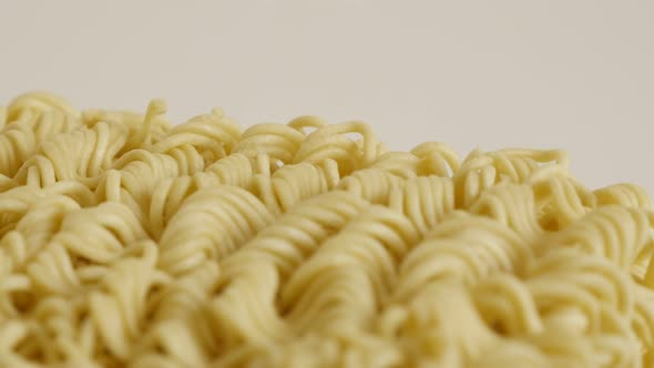 Chinese   noodles surface close-up 4K 2160p 30fps UltraHD tilting footage - Instant food block ready
