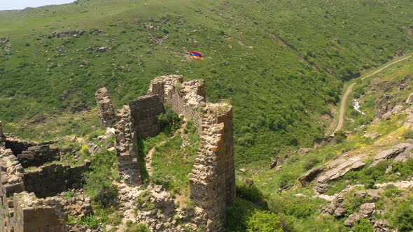 Armenian Flag Waving on the Ancient Hill Fortress Amberd in Armenia Aragats