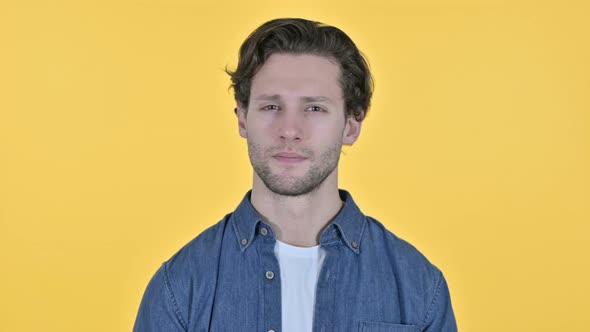 No Gesture By Young Man, Head Shake on Yellow Background